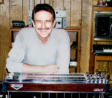 Buddy with his new baby in his music room